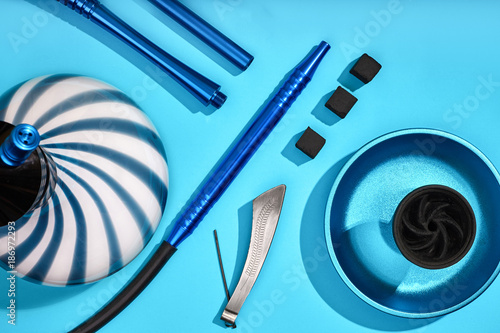 Top view of Hookah parts on light blue background photo