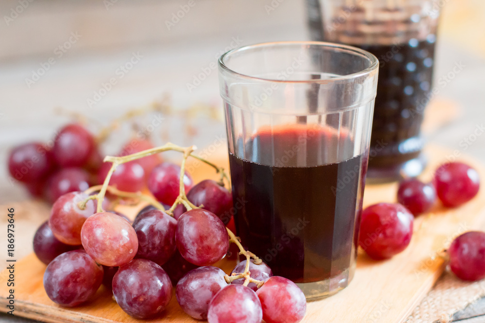 Grapes and a glass of wine on the table Grapes and a glass of wine on the table