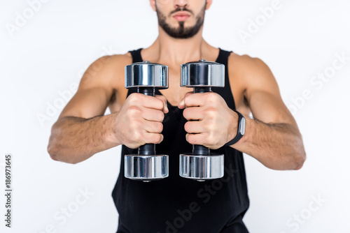 cropped shot of man working out with dumbbells isolated on white
