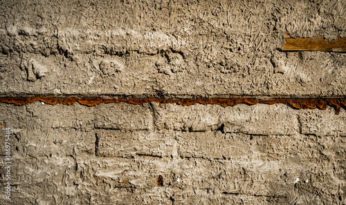 Plastered brick wall texture background. Building wall. Old plastered wall surface background photo