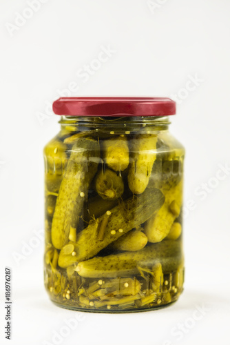 pickled gherkins with spices in a jar
