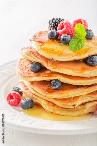 Closeup of american pancakes with blueberries and raspberries