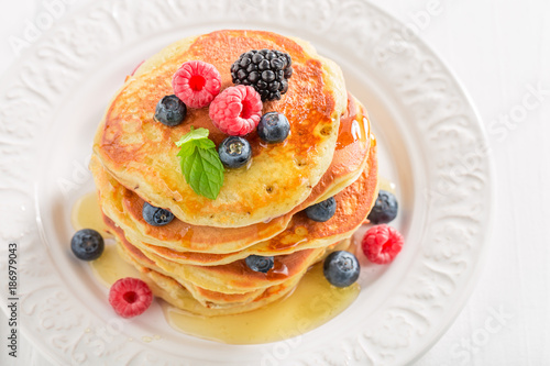 Sweet and delicious american pancakes with berries