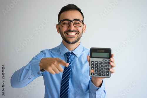 Smiling Business Man Showing Calculator