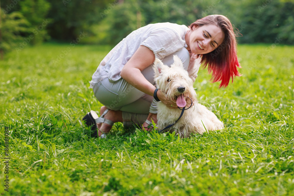 Young girl with a dog in the park Young girl with a dog in the park