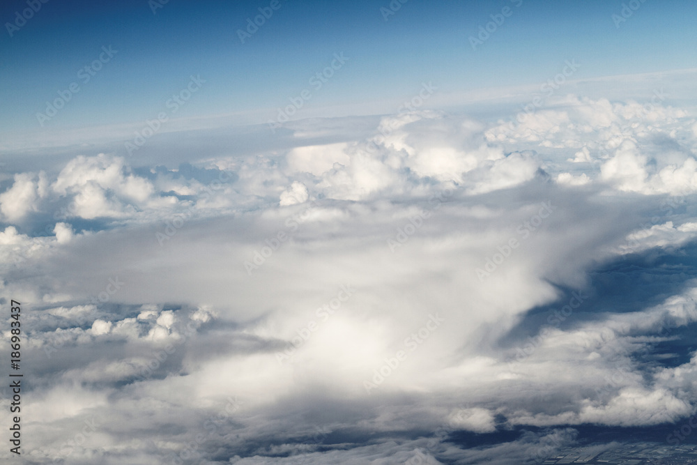 Sunrise above clouds from airplane window