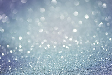 Blue glittering holiday Christmas lights. Blurred abstract festive  background