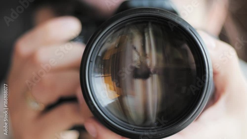 photographer taking picture, close dslr lens photo