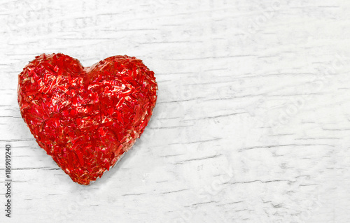 Luxury red heart on white wooden background. Happy Valentines day. Glitter love confetti.
