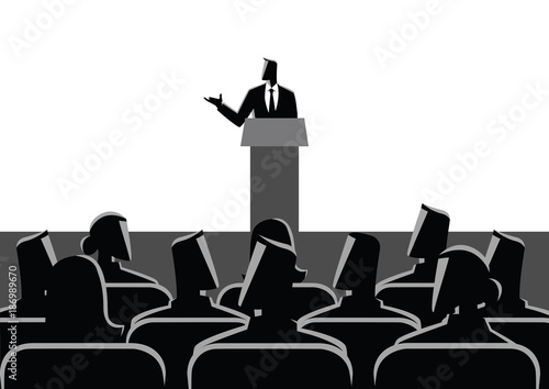 Man Giving A Speech On Stage