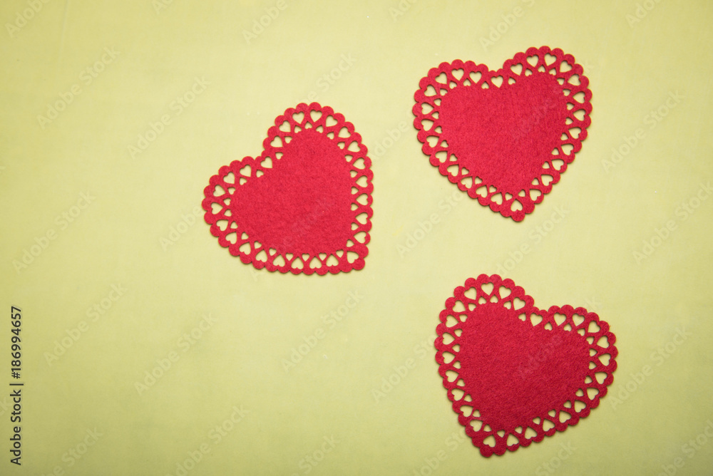 red box for jewelry with a heart inside on a yellow background red box for jewelry with a heart inside on a yellow background