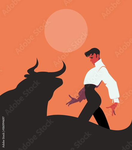 Elegant and handsome Spanish flamenco dancer, dancing in front of a bull under the sun or the moon