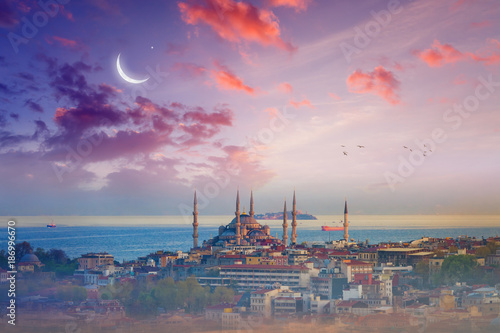 Photography Blue Mosque, glowing sunset with crescent in Istanbul, Turkey