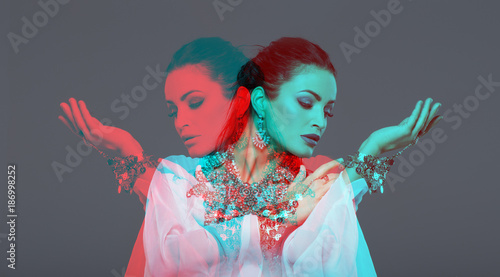 Sexy belly dancer performer in double exposure style