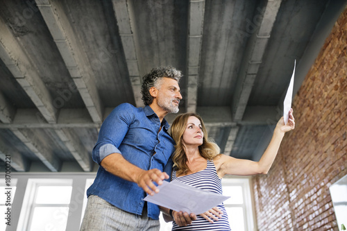 Team of architects discussing the rebuilding of a loft office