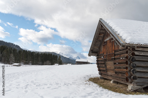 Rustic wooden hay loft in marvellous winter landscape