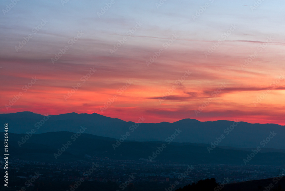 Romantic, bright and colorful sunset over a mountain range in Transilvania. Beautiful, colorful autumn background. Romantic, bright and colorful sunset over a mountain range in Transilvania. Beautiful, colorful autumn background.