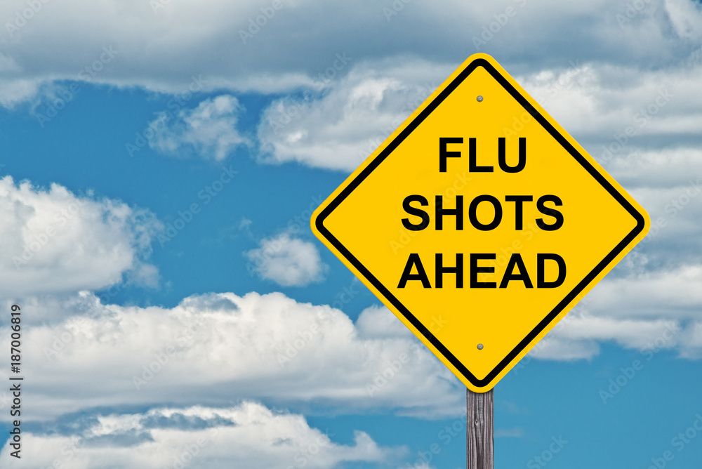 Flu Shots Ahead - Caution Sign Blue Sky