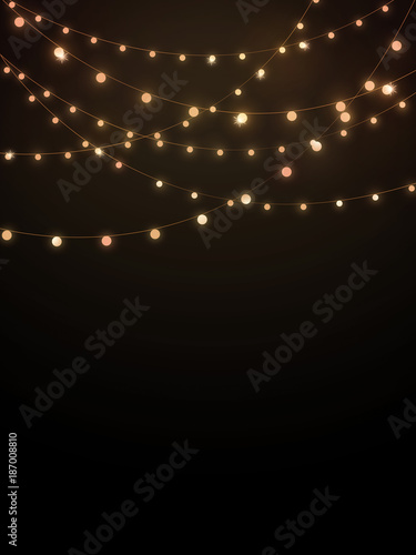 Gold string lights on black background