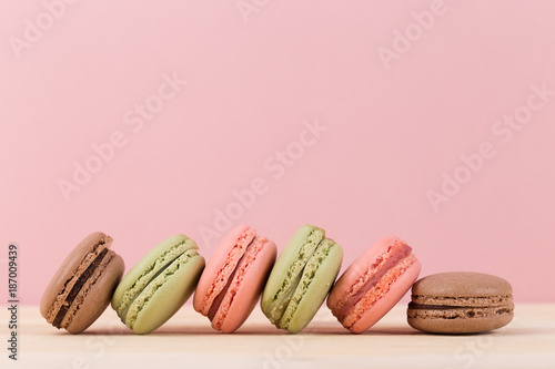 Colorful macaroons on pink background