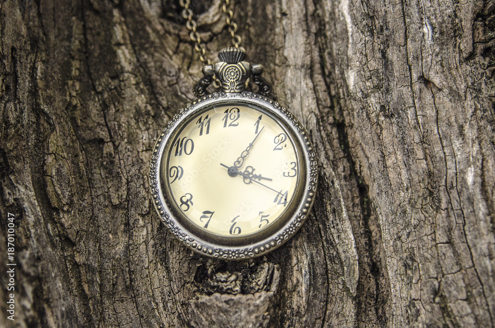 Antique clock, wooden background Antique clock, wooden background