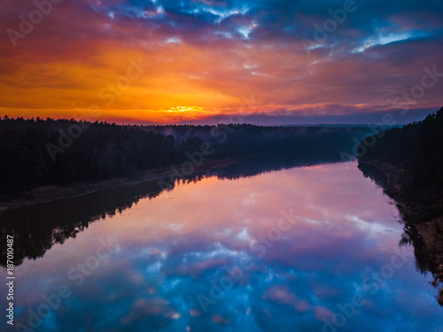 Fototapeta Naklejka Na Ścianę i Meble -  Aerial sunrise or sunset with colorful sky and water