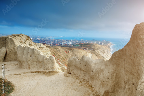 Mountains and a sea landscape with the blue sky. Black Sea, Russia. Beautiful view of the city.