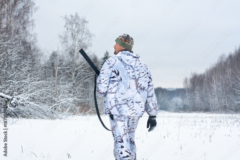hunter with shotgun during winter hunt