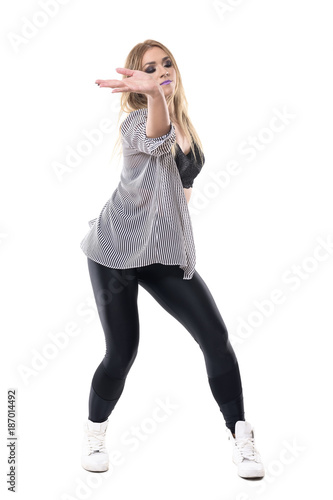 Elegant female jazz dancer dancing passionately with close eyes. Full body length portrait isolated on white studio background. 