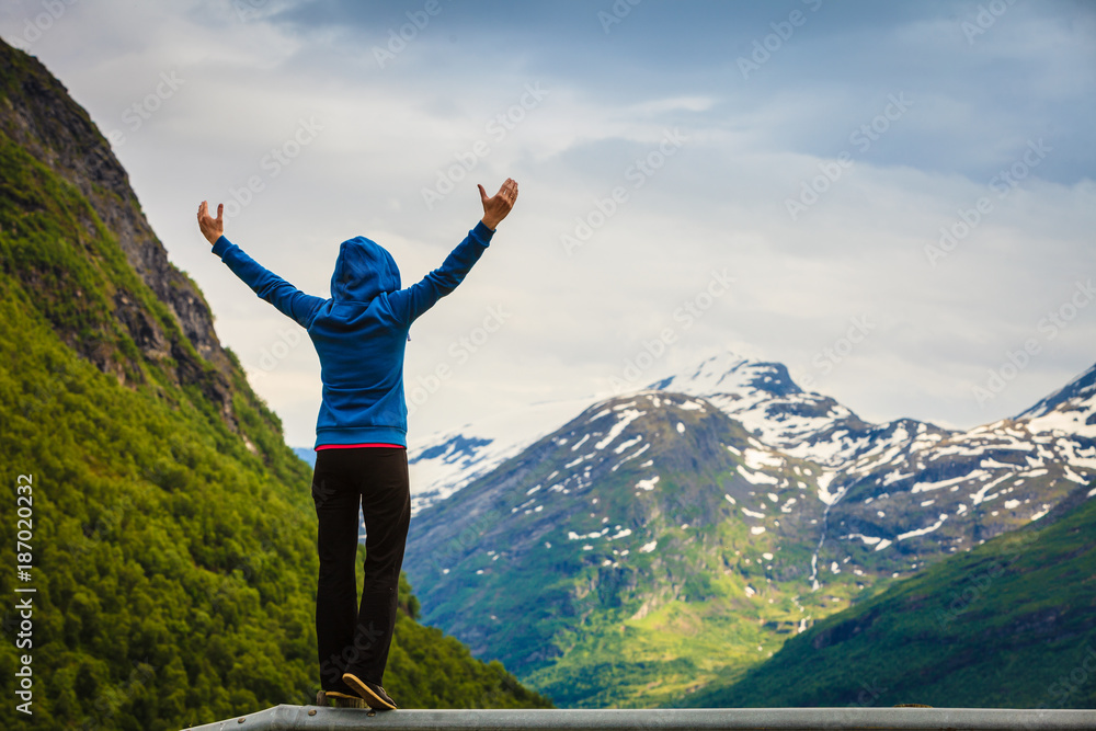 Tourist woman enjoying mountains landscape in Norway. Tourist woman enjoying mountains landscape in Norway.