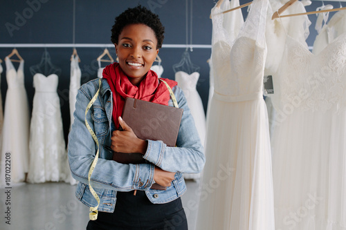 Wedding dress store owner with a diary