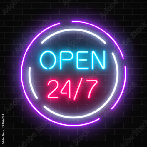 Neon open 24 hours 7 days a week sign in circle shaps on a brick wall background.