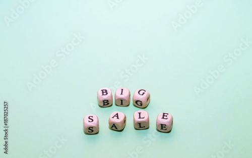 Word big sale from cubes on a green background