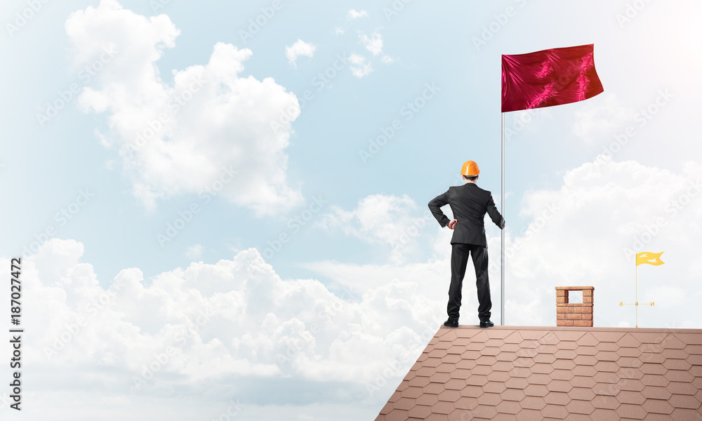 Young businessman with flag presenting concept of leadership. Mixed media Young businessman with flag presenting concept of leadership. Mixed media