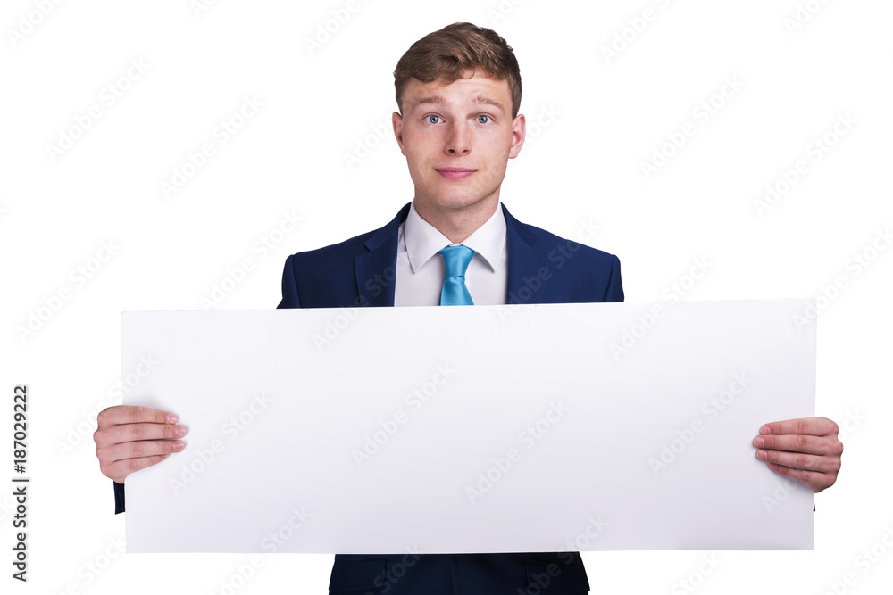 Businessman in blue siut holding blank banner board, isolated over white background, half body view.