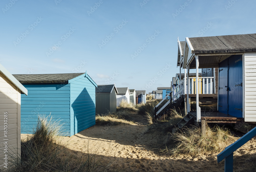 Beach huts in the sand dunes at Old Hunstanton, Norfolk, UK. Beach huts in the sand dunes at Old Hunstanton, Norfolk, UK.