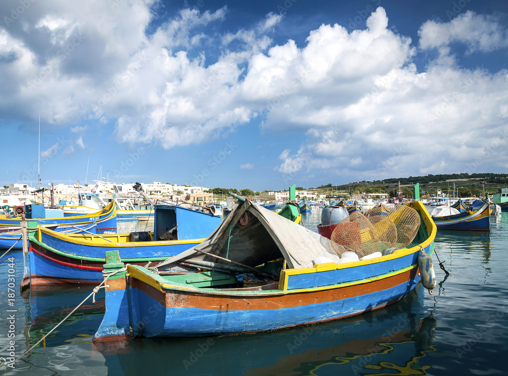 maltese traditional painted luzzu boats in marsaxlokk fishing village malta