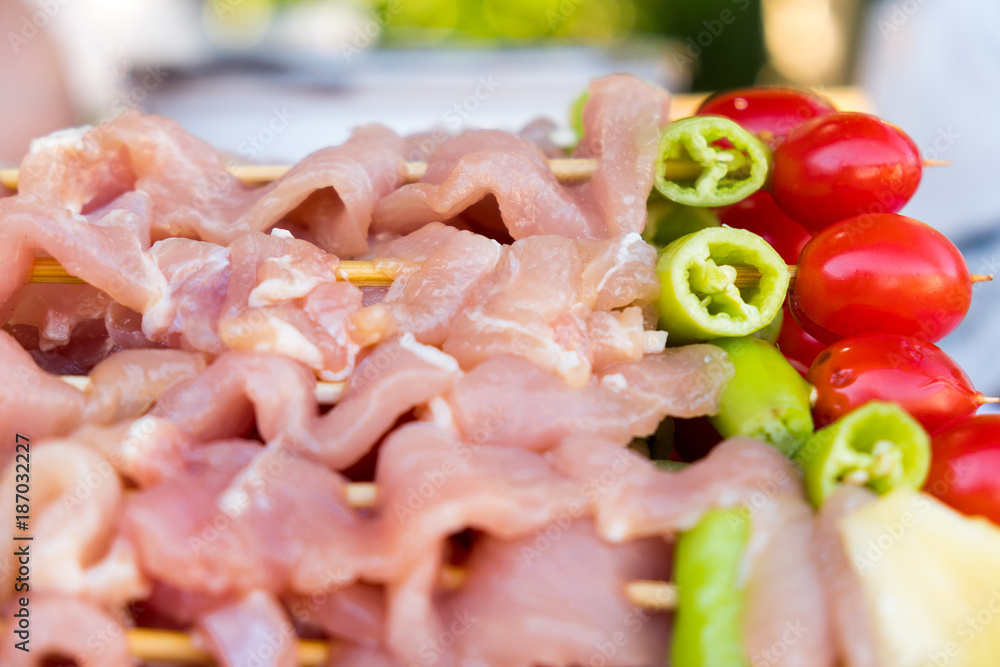 A lot of pork meat was made barbecue with chili pepper, tomato and pineapple for dinner party at backyard