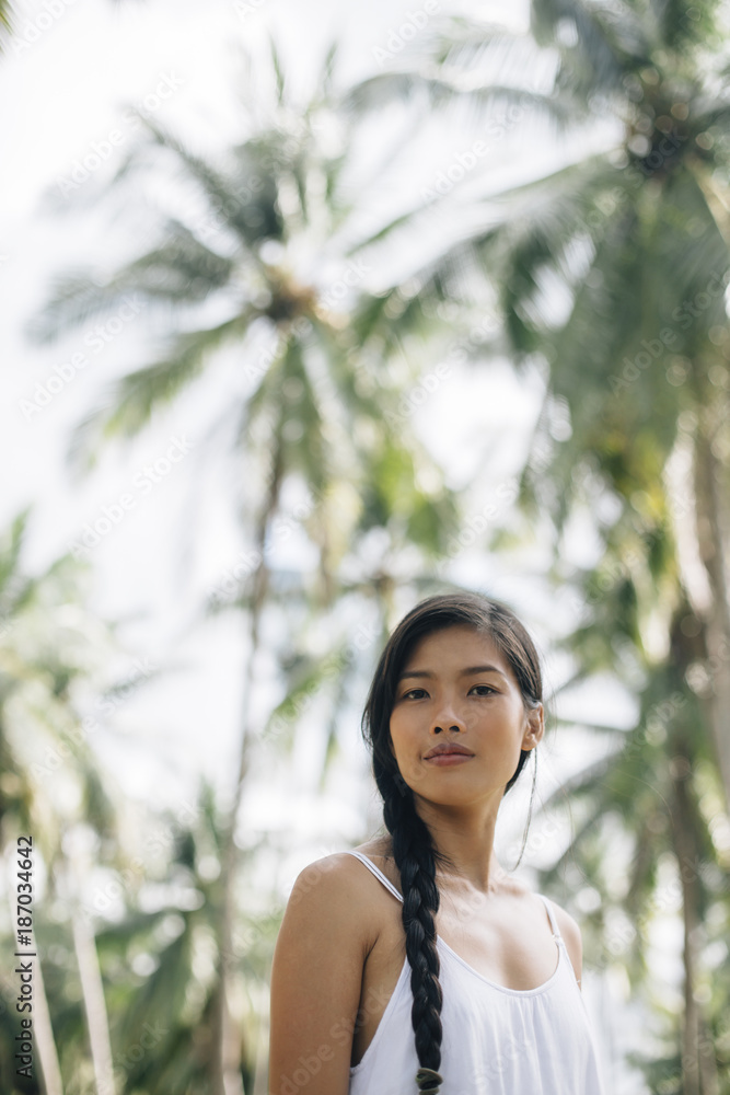 Woman in coconut jungle