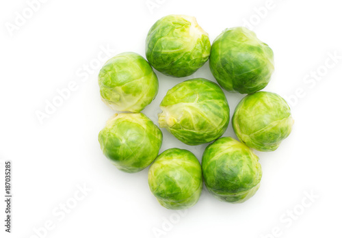 Boiled Brussels sprout heads folded like flower top view isolated on white background.