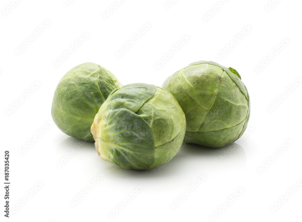 Raw Brussels sprout three heads isolated on white background. Raw Brussels sprout three heads isolated on white background.