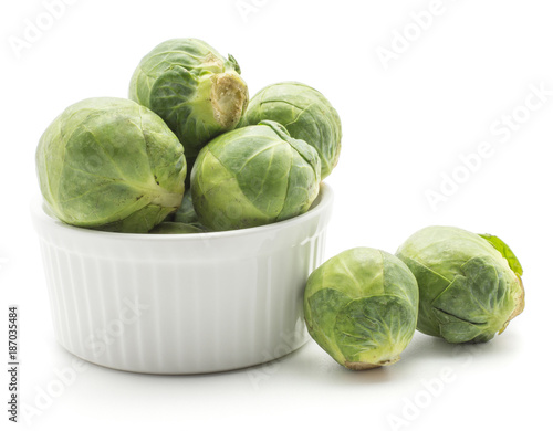 Brussels sprout heads in ceramic mold isolated on white background raw and fresh.
