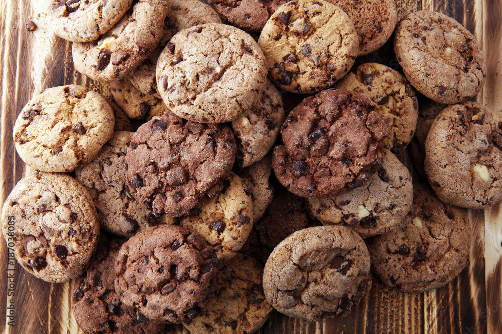 Chocolate cookies on wooden table. Chocolate chip cookies shot Chocolate cookies on wooden table. Chocolate chip cookies shot