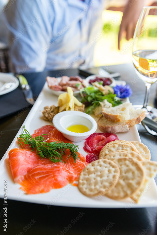 sharing seafood platter at a winery sharing seafood platter at a winery