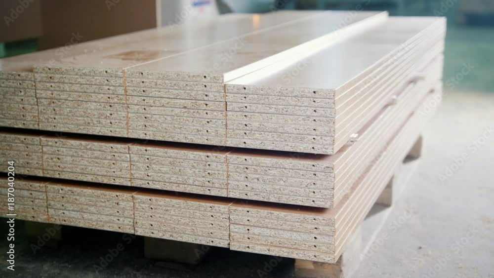 Stack of wood particleboard panels on the warehouse or factory Stack of wood particleboard panels on the warehouse or factory
