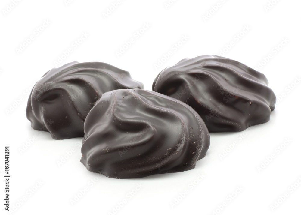 Three dark chocolate-coated zefir isolated on white background. Three dark chocolate-coated zefir isolated on white background.