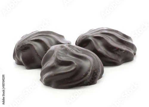 Three dark chocolate-coated zefir isolated on white background.