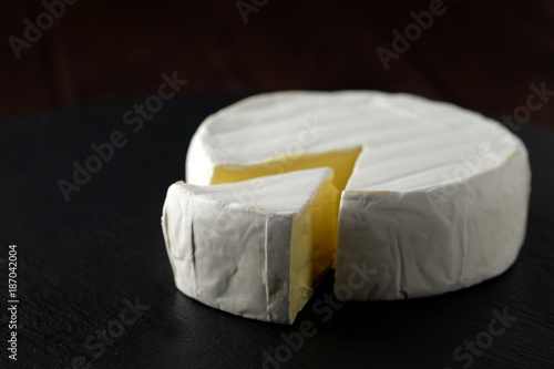 Tableau sur toile French cheese brie on slate plate.