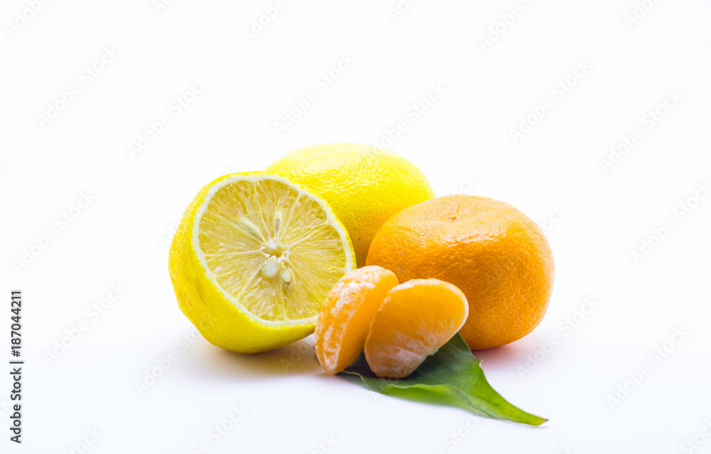 Lemon and tangerine on a white background Lemon and tangerine on a white background