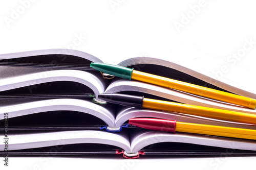 Four books with multi-colored handles